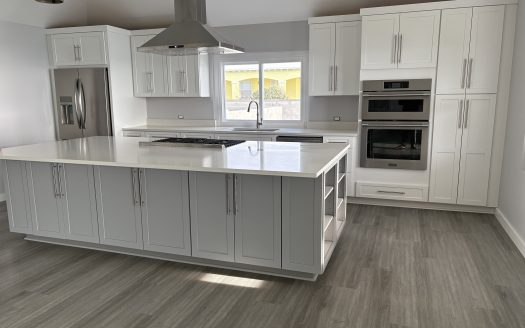 Elevated Southampton living with sweeping southwest water views and built-in income.